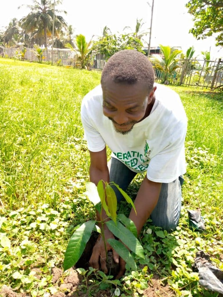 Image of Member of Eco Scout Movement of Ghana Planting a Mango tree at Cape Coast Community Graden on Green Ghana Day 768x1024 Image of oscoutghana
